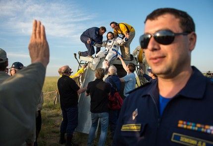 Expedition 43 cosmonaut Anton Shkaplerov of the Russian Federal Space Agency (Roscosmos) is helped out of the Soyuz TMA-15M spacecraft just minutes after he and NASA astronaut Terry Virts of NASA, and Italian astronaut Samantha Cristoforetti from European Space Agency (ESA) landed in a remote area near the town of Zhezkazgan, Kazakhstan on Thursday, June 11, 2015. Virts, Shkaplerov, and Cristoforetti are returning after more than six months onboard the International Space Station where they served as members of the Expedition 42 and 43 crews. Photo Credit: (NASA/Bill Ingalls)