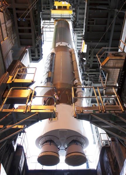 ULA's Atlas V Solid Rocket Booster (SRB) being lifted and stationed onto stand at Pad 41 for the OSIRIS-REx upcoming launch.