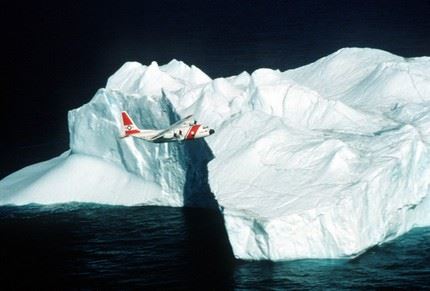 A Coast Guard C-130 fixed wing aircraft overflies an iceberg during patrol.  Service with the International Ice Patrol is one of the many operations of the C-130. (U.S. Coast Guard photo)
