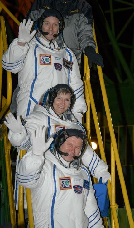 Expedition 50 crewmembers ESA astronaut Thomas Pesquet, top, NASA astronaut Peggy Whitson, middle, and Russian cosmonaut Oleg Novitskiy of Roscosmos wave farewell before boarding their Soyuz MS-03 spacecraft for launch Thursday, Nov. 17, 2016, (Kazakh Time) in Baikonur, Kazakhstan. The trio will launch from the Baikonur Cosmodrome in Kazakhstan the morning of November 18 (Kazakh time.) All three will spend approximately six months on the orbital complex. Photo Credit: (NASA/Bill Ingalls)